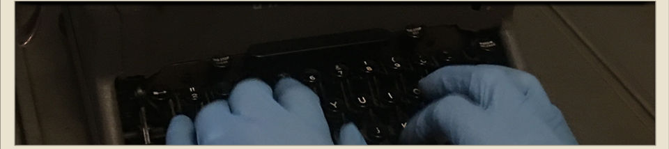 gloved hands typing
