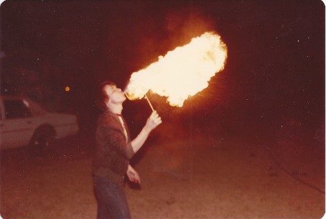 Scott blowing fire